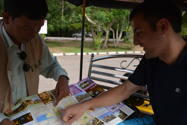 My brother Andy discussing the temples we would like to visit with our tuk tuk driver.