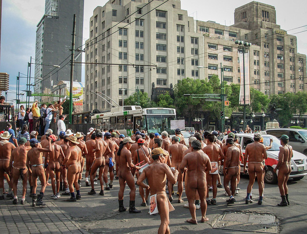 From Cassie: I came upon this rather surprising crowd in Mexico City back in 2007. A group of nude, male farmers from the State of Veracruz were blocking traffic to protest a land-use decision made by a corrupt local politician. They were wearing the elected official’s face as a loincloth. Just another morning in Mexico City!