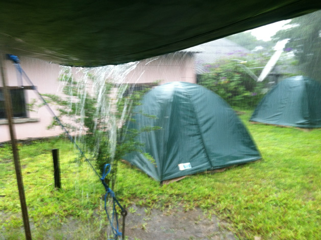 Rain pouring off of our cooking canopy at breakfast.