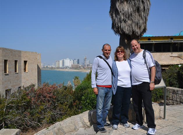 Dan and his parents in Jaffa, overlooking the Tel Aviv skyline.