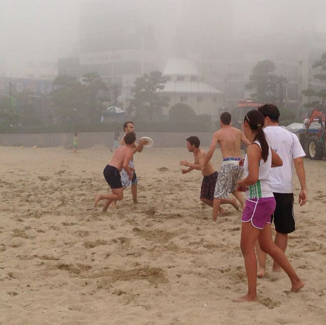 Playing beach ultimate frisbee in Busan, South Korea